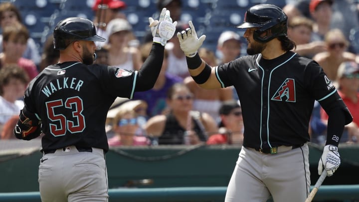 Jun 20, 2024; Washington, District of Columbia, USA; Arizona Diamondbacks first baseman Christian Walker (53) cleebrates with Diamondbacks third baseman Eugenio Suárez (28) after hitting a solo home run against the Washington Nationals during the ninth inning at Nationals Park. Mandatory Credit: Geoff Burke-USA TODAY Sports