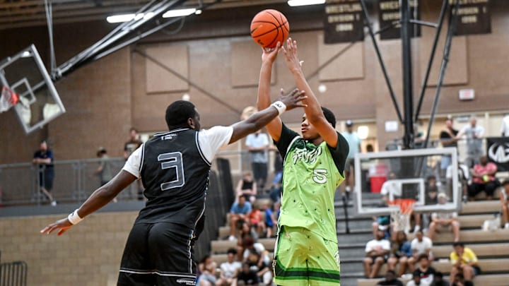 Team Faygo and Michigan State's Divine Ugochukwu, right, makes a 3-pointer against Team Motorcars during the Moneyball Pro-Am on Tuesday, June 24, 2025, at Holt High School. Team Faygo and Michigan State's Divine Ugochukwu, right, makes a 3-pointer against Team Motorcars during the Moneyball Pro-Am on Tuesday, June 24, 2025, at Holt High School.
