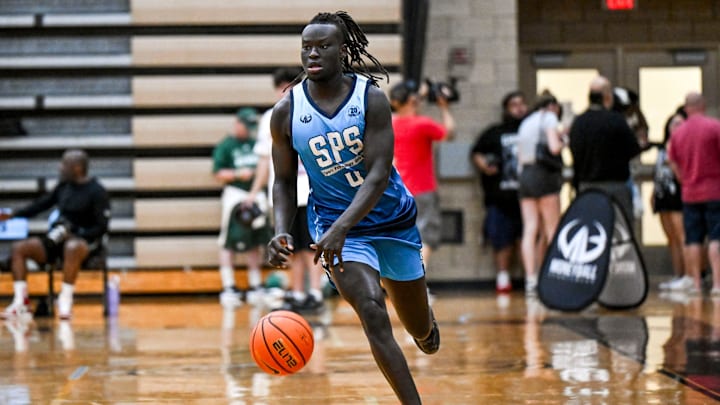 Team SPS and Michigan State's Kur Teng moves the ball against Team Case Credit Union during the Moneyball Pro-Am on Tuesday, June 24, 2025, at Holt High School.