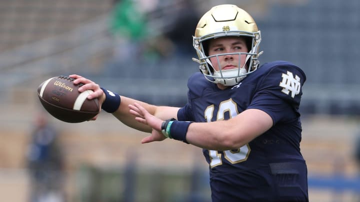 Notre Dame quarterback Riley Leonard (13) who is hurt, dresses and throws some pre-game passes with fellow quarterbacks Saturday, April 20, 2024, at the annual Notre Dame Blue-Gold spring football game at Notre Dame Stadium in South Bend. Notre Dame quarterback Riley Leonard (13) who is hurt, dresses and throws some pre-game passes with fellow quarterbacks Saturday, April 20, 2024, at the annual Notre Dame Blue-Gold spring football game at Notre Dame Stadium in South Bend.