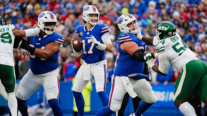 Buffalo Bills quarterback Josh Allen (17) gets pass protection from O'Cyrus Torrence (64) and Connor McGovern (66) during first half action at the Bills home game against the New York Jets at Highmark Stadium in Orchard Park on Dec. 29, 2024.
