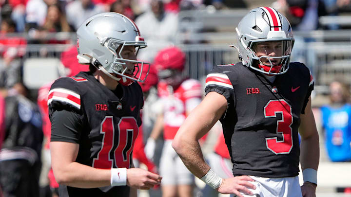 Ohio State Buckeye quarterbacks Julian Sayin (10) and Lincoln Kienholz (3) warm up before the start of the spring game at Ohio Stadium on April 12, 2025.