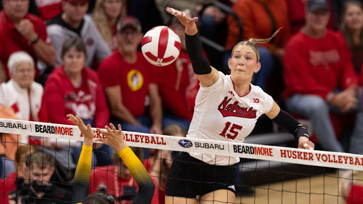 Nebraska middle blocker attacks against Iowa.