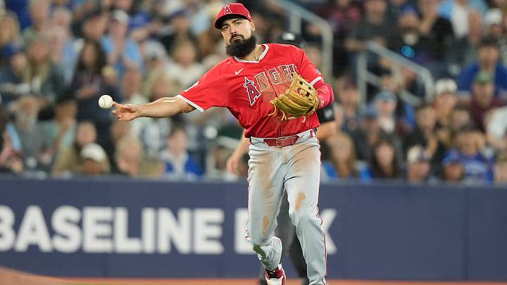 Aug 23, 2024; Toronto, Ontario, CAN; Los Angeles Angels third baseman Anthony Rendon (6) throws out Toronto Blue Jays shortstop Ernie Clement (not pictured) at first base during the sixth inning at Rogers Centre. Mandatory Credit: John E. Sokolowski-USA TODAY Sports