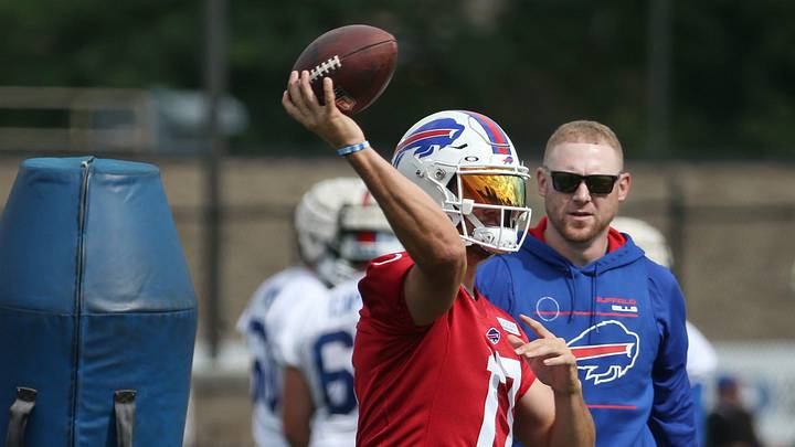 Bills quarterbacks coach Joe Brady, right, watches as Josh Allen (17) throws downfield St. John Fisher University in Rochester Monday, July 25, 2022.