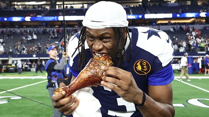 Nov 27, 2025; Arlington, Texas, USA; Dallas Cowboys wide receiver George Pickens (3) celebrates by eating turkey after the game against the Kansas City Chiefs at AT&T Stadium. Mandatory Credit: Kevin Jairaj-Imagn Images