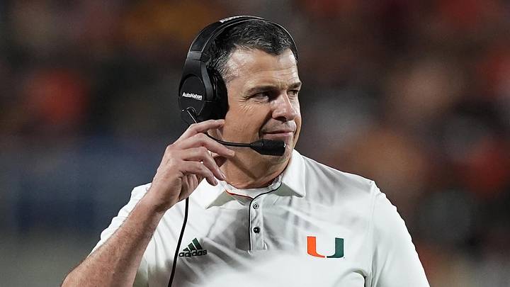 Dec 28, 2024; Orlando, FL, USA; Miami Hurricanes head coach Mario Cristobal walks on the field during the second half against the Iowa State Cyclones at Camping World Stadium. Mandatory Credit: Jasen Vinlove-Imagn Images
