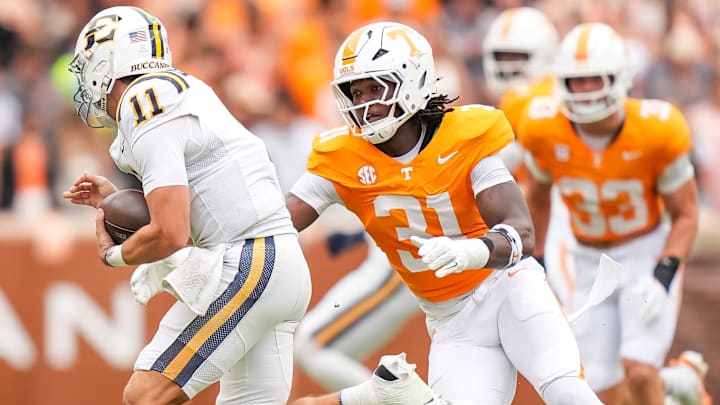 Tennessee defensive lineman Caleb Herring (31) chases down ETSU quarterback Cade McNamara (11) during Tennessee's home opener against ETSU at Neyland Stadium in Knoxville, Tenn., on Sept. 6, 2025.