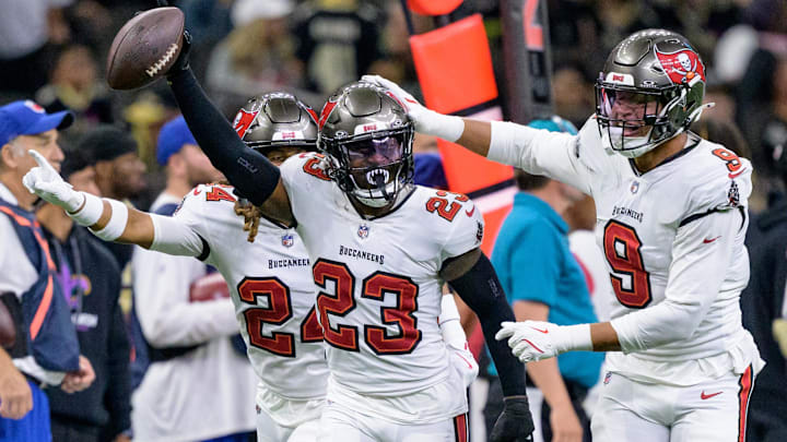 Oct 13, 2024; New Orleans, Louisiana, USA; Tampa Bay Buccaneers safety Tykee Smith (23) celebrates an interception of a ball intended for New Orleans Saints wide receiver Rashid Shaheed (22) with cornerback Tyrek Funderburk (24) and linebacker Joe Tryon-Shoyinka (9) during the fourth quarter at Caesars Superdome. Mandatory Credit: Matthew Hinton-Imagn Images Oct 13, 2024; New Orleans, Louisiana, USA; Tampa Bay Buccaneers safety Tykee Smith (23) celebrates an interception of a ball intended for New Orleans Saints wide receiver Rashid Shaheed (22) with cornerback Tyrek Funderburk (24) and linebacker Joe Tryon-Shoyinka (9) during the fourth quarter at Caesars Superdome. Mandatory Credit: Matthew Hinton-Imagn Images