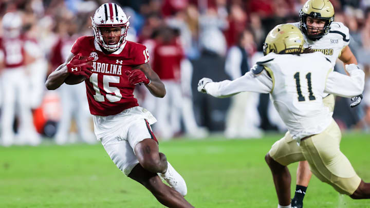 Nov 23, 2024; Columbia, South Carolina, USA; South Carolina Gamecocks wide receiver Dalevon Campbell (15) runs after a reception against Wofford Terriers defensive back Javis Mynatt (11) in the second quarter at Williams-Brice Stadium. Mandatory Credit: Jeff Blake-Imagn Images