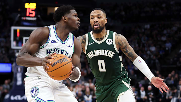Feb 23, 2024; Minneapolis, Minnesota, USA; Minnesota Timberwolves guard Anthony Edwards (5) works around Milwaukee Bucks guard Damian Lillard (0) during the second half at Target Center. Feb 23, 2024; Minneapolis, Minnesota, USA; Minnesota Timberwolves guard Anthony Edwards (5) works around Milwaukee Bucks guard Damian Lillard (0) during the second half at Target Center.