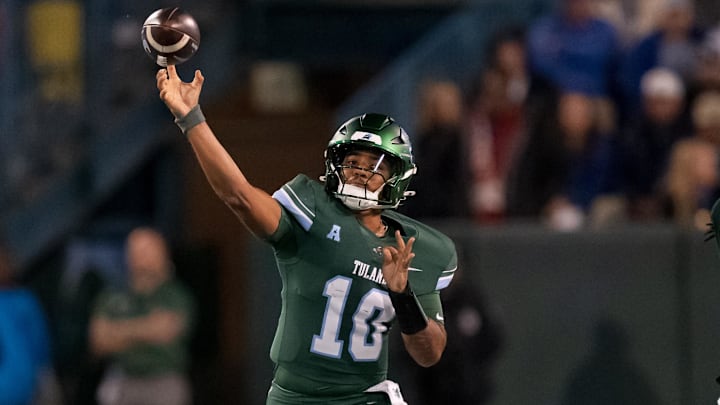 Nov 28, 2024; New Orleans, Louisiana, USA; Tulane Green Wave quarterback Darian Mensah (10) throws against the Memphis Tigers during the first quarter at Yulman Stadium. Nov 28, 2024; New Orleans, Louisiana, USA; Tulane Green Wave quarterback Darian Mensah (10) throws against the Memphis Tigers during the first quarter at Yulman Stadium.