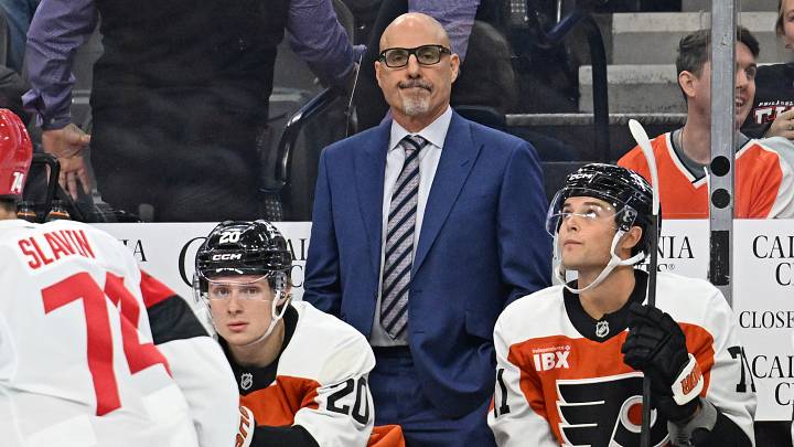 Oct 3, 2026; Philadelphia, Pennsylvania, USA; Philadelphia Flyers head coach Rick Tocchet behind the bench against the Carolina Hurricanes during the first period at Xfinity Mobile Arena.