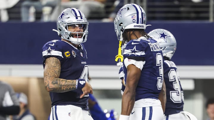 Dallas Cowboys quarterback Dak Prescott celebrates with wide receiver George Pickens after a touchdown pass caught by Pickens during the second quarter at AT&T Stadium. Dallas Cowboys quarterback Dak Prescott celebrates with wide receiver George Pickens after a touchdown pass caught by Pickens during the second quarter at AT&T Stadium.