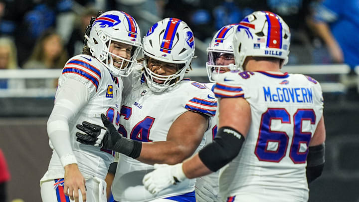 Buffalo Bills quarterback Josh Allen (17) celebrates his touchdown with teammates, during the first half at Ford Field in Detroit on Sunday, Dec. 15, 2024.