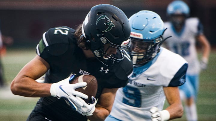 Fossil Ridge's Mac Busteed catches a pass during his team's football game against Ralston Valley, Thursday, Aug. 26, 2021, at French Field in Fort Collins. Ralston Valley Mustangs defeated Fossil Ridge Sabercats 21-3.