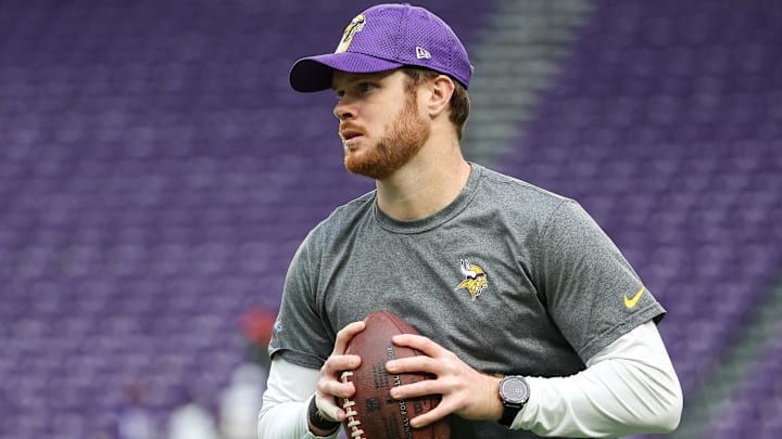 Dec 8, 2024; Minneapolis, Minnesota, USA; Minnesota Vikings quarterback Sam Darnold (14) warms up before the game against the Atlanta Falcons at U.S. Bank Stadium.