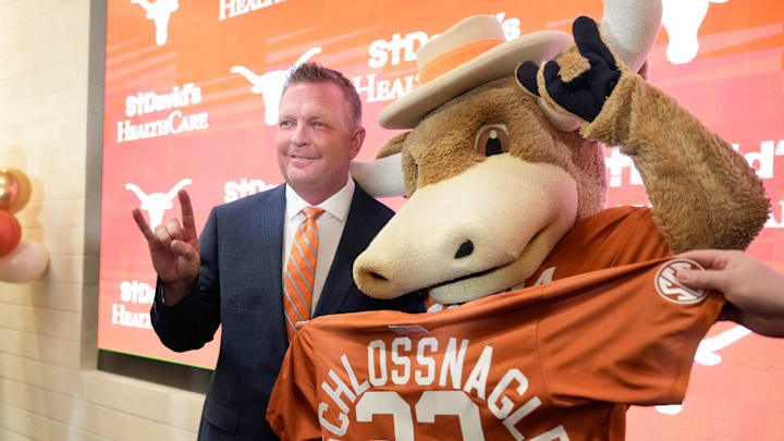 University of Texas baseball coach Jim Schlossnagle poses for a photo with Hook ‘Em at his introductory news conference at the Frank Denius Family University Hall of Fame Wednesday June 26, 2024.