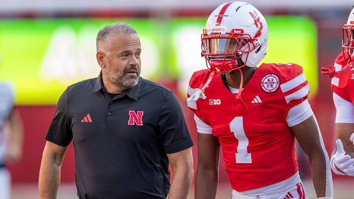 Matt Rhule and team captain Ceyair Wright converse on the sideline prior to kickoff against Akron. 