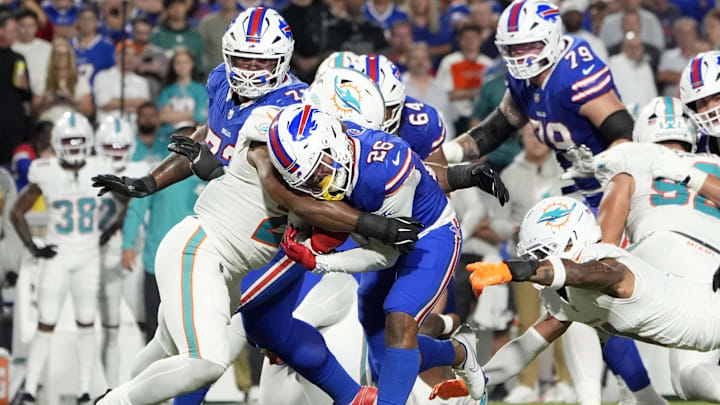 Miami Dolphins linebacker Jordyn Brooks (20) tackles Buffalo Bills running back Ty Johnson (26) in the fourth quarter at Highmark Stadium in Week 3.