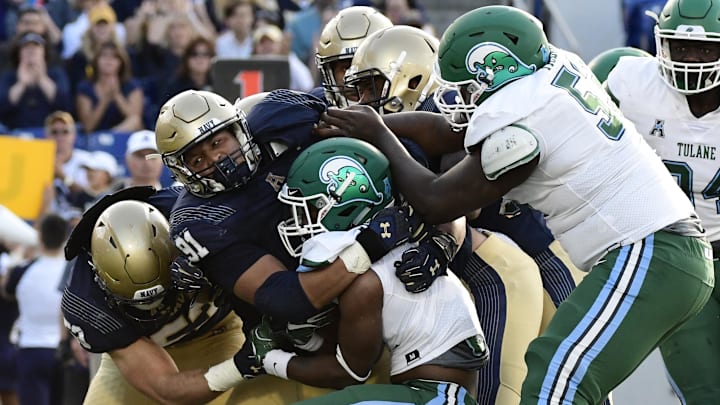 Sep 9, 2017; Annapolis, MD, USA;  Navy Midshipmen defensive end Tyler Sayles (91) wraps up Tulane Green Wave running back Stephon Huderson (22) in the back field for a loo during the third quarter at Navy-Marine Corps Memorial Stadium. Navy Midshipmen defeated Tulane Green Wave 23-21.