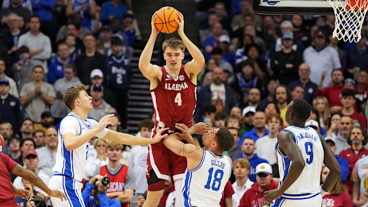 Mar 29, 2025; Newark, NJ, USA; Alabama Crimson Tide forward Grant Nelson (4) passes the ball against Duke Blue Devils forward Mason Gillis (18) during the second half in the East Regional final of the 2025 NCAA tournament at Prudential Center. Mandatory Credit: Robert Deutsch-Imagn Images