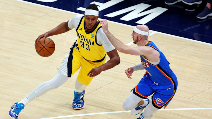 Indiana Pacers center Turner drives against Oklahoma City Thunder guard Caruso during the 2025 NBA Finals at Gainbridge Fieldhouse. 