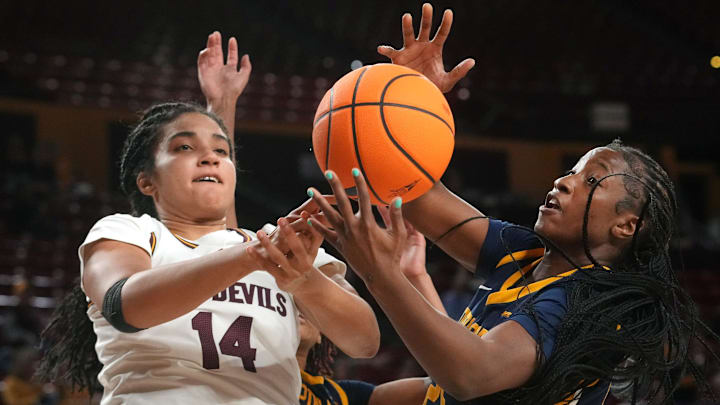 ASU Sun Devils forward Heloisa Carrera (14) fights for a rebound with Coppin State Bald Eagles forward Shanaii Gamble (25) at Desert Financial Arena on Nov. 3, 2025.