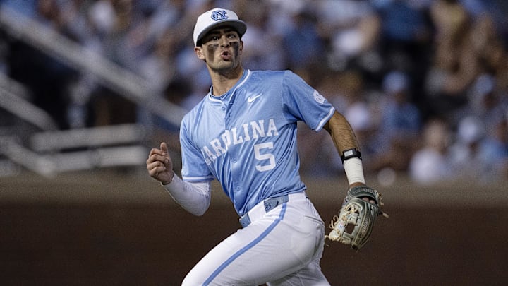 Jun 8, 2024; Chapel Hill, NC, USA; North Carolina Tar Heels Gavin Gallaher (5) reacts to making an out against the West Virginia Mountaineers in the fifth inning of the DI Baseball Super Regional at Boshamer Stadium. Mandatory Credit: Jeffrey Camarati-Imagn Images

