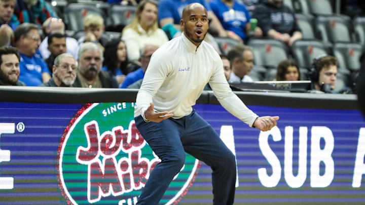 Seton Hall Pirates head coach Shaheen Holloway gets into a defensive stance on the sidelines while coaching at the Prudential Center.