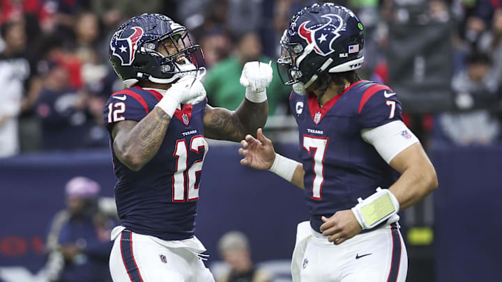 Jan 13, 2024; Houston, Texas, USA; Houston Texans wide receiver Nico Collins (12) celebrates with quarterback C.J. Stroud (7) after a touchdown in a 2024 AFC wild card game against the Cleveland Browns at NRG Stadium. Mandatory Credit: Troy Taormina-Imagn Images