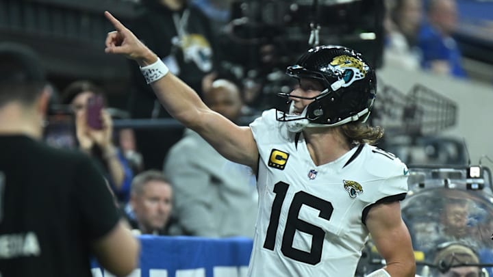 Dec 28, 2025; Indianapolis, Indiana, USA; Jacksonville Jaguars quarterback Trevor Lawrence (16) reacts after a touchdown during the second half against the Indianapolis Colts at Lucas Oil Stadium. 