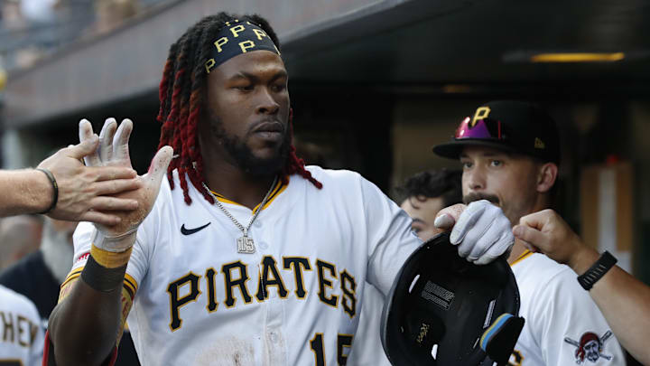 Jul 22, 2025; Pittsburgh, Pennsylvania, USA;  Pittsburgh Pirates center fielder Oneil Cruz (15) high-fives in the dugout after scoring a run on a Detroit Tigers error during the third inning at PNC Park. Mandatory Credit: Charles LeClaire-Imagn Images