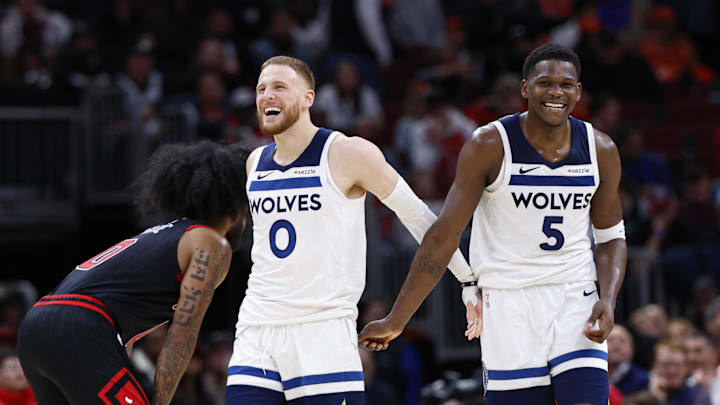 Nov 7, 2024; Chicago, Illinois, USA; Minnesota Timberwolves guard Anthony Edwards (5) and guard Donte DiVincenzo (0) react during the second half of a basketball game against the Chicago Bulls at United Center. Mandatory Credit: Kamil Krzaczynski-Imagn Images