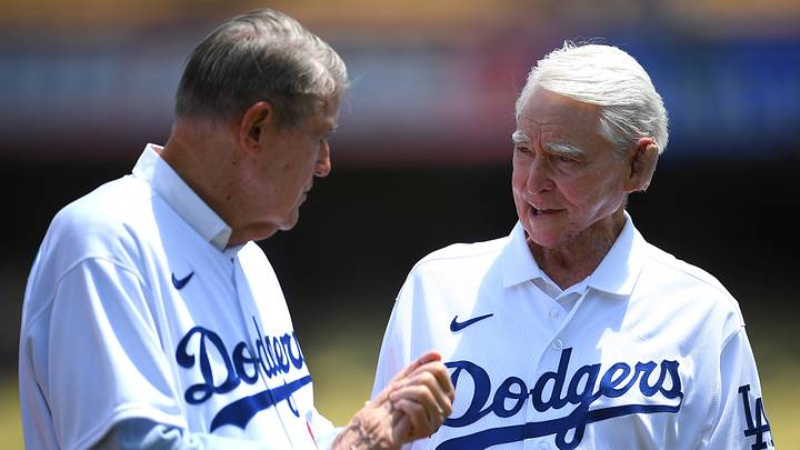 Jul 25, 2021; Los Angeles, California, USA; Former owner of the Los Angeles Dodgers Peter OÕMalley talks with former general manager Fred Claire as the 1981 team was honored during pregame ceremonies at Dodger Stadium. Mandatory Credit: Jayne Kamin-Oncea-USA TODAY Sports