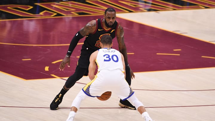 June 8, 2018; Cleveland, OH, USA; Cleveland Cavaliers forward LeBron James (23) defends against Golden State Warriors guard Stephen Curry (30) during the first quarter in game four of the 2018 NBA Finals at Quicken Loans Arena. The Warriors defeated the Cavaliers 108-85 to complete a four-game sweep. Mandatory Credit: Kyle Terada-Imagn Images