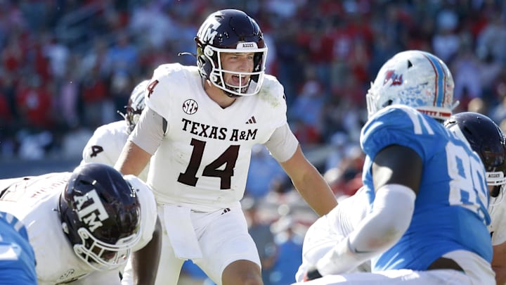 Nov 4, 2023; Oxford, Mississippi, USA; Texas A&M Aggies quarterback Max Johnson (14) gives direction prior to the snap during the second half against the Mississippi Rebels at Vaught-Hemingway Stadium. Mandatory Credit: Petre Thomas-Imagn Images