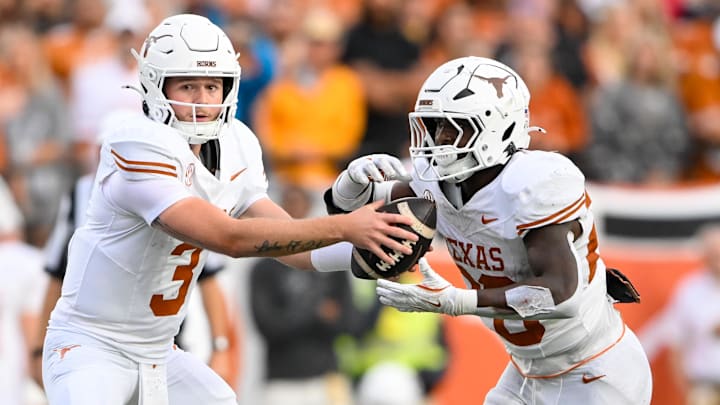 Oct 26, 2024; Nashville, Tennessee, USA; Texas Longhorns quarterback Quinn Ewers (3) hands the ball off to running back Quintrevion Wisner (26) against the Vanderbilt Commodores during the second half at FirstBank Stadium. Mandatory Credit: Steve Roberts-Imagn Images Oct 26, 2024; Nashville, Tennessee, USA; Texas Longhorns quarterback Quinn Ewers (3) hands the ball off to running back Quintrevion Wisner (26) against the Vanderbilt Commodores during the second half at FirstBank Stadium. Mandatory Credit: Steve Roberts-Imagn Images