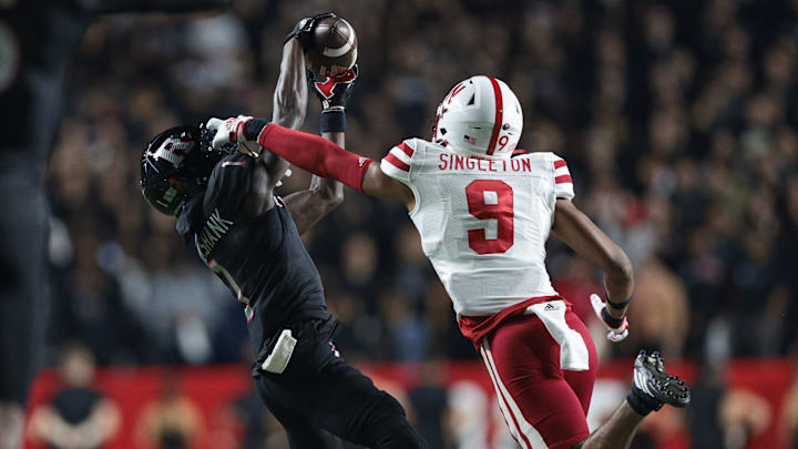 Oct 7, 2022; Piscataway, New Jersey, USA; Rutgers Scarlet Knights wide receiver Aron Cruickshank (1) catches  a pass as Nebraska Cornhuskers defensive back DeShon Singleton (9) defends during the first half at SHI Stadium. 