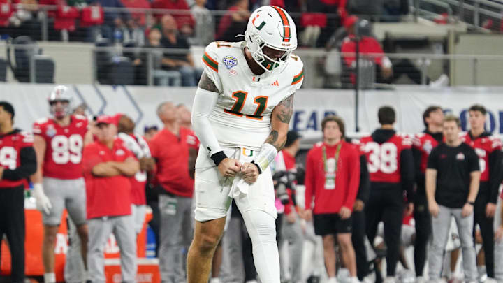 Dec 31, 2025; Arlington, TX, USA; Miami Hurricanes quarterback Carson Beck (11) reacts after a successful pass in the fourth quarter against the Ohio State Buckeyes during the 2025 Cotton Bowl and quarterfinal game of the College Football Playoff at AT&T Stadium. Mandatory Credit: Raymond Carlin III-Imagn Images Dec 31, 2025; Arlington, TX, USA; Miami Hurricanes quarterback Carson Beck (11) reacts after a successful pass in the fourth quarter against the Ohio State Buckeyes during the 2025 Cotton Bowl and quarterfinal game of the College Football Playoff at AT&T Stadium. Mandatory Credit: Raymond Carlin III-Imagn Images