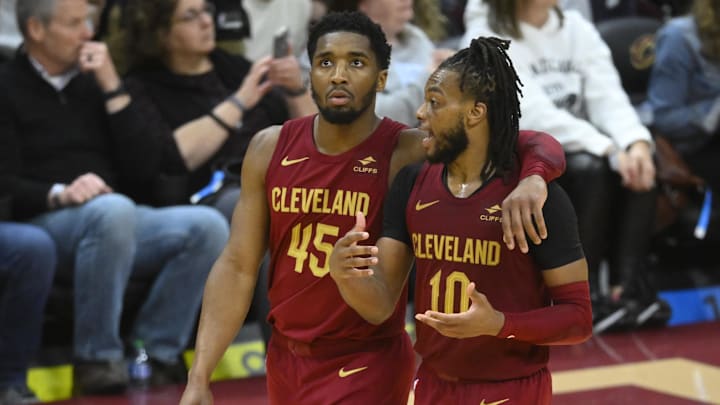 Apr 12, 2024; Cleveland, Ohio, USA; Cleveland Cavaliers guard Donovan Mitchell (45) and guard Darius Garland (10) talk in the fourth quarter against the Indiana Pacers at Rocket Mortgage FieldHouse. Mandatory Credit: David Richard-Imagn Images