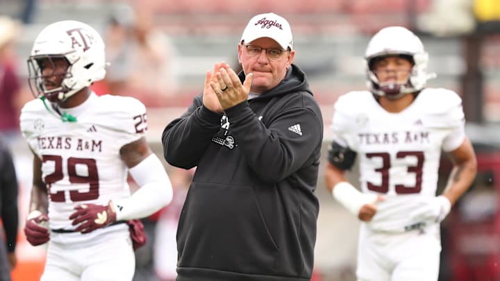 Oct 18, 2025; Fayetteville, Arkansas, USA; Texas A&M Aggies head coach Mike Elko prior to the game against the Arkansas Razorbacks at Donald W. Reynolds Razorback Stadium. Mandatory Credit: Nelson Chenault-Imagn Images Oct 18, 2025; Fayetteville, Arkansas, USA; Texas A&M Aggies head coach Mike Elko prior to the game against the Arkansas Razorbacks at Donald W. Reynolds Razorback Stadium. Mandatory Credit: Nelson Chenault-Imagn Images