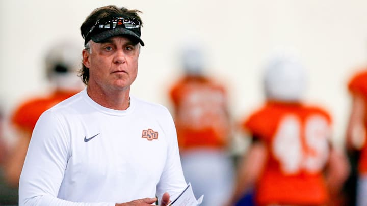Head coach Mike Gundy runs drills during an Oklahoma State football practice in Stillwater, Okla., on Tuesday, April 23, 2024.