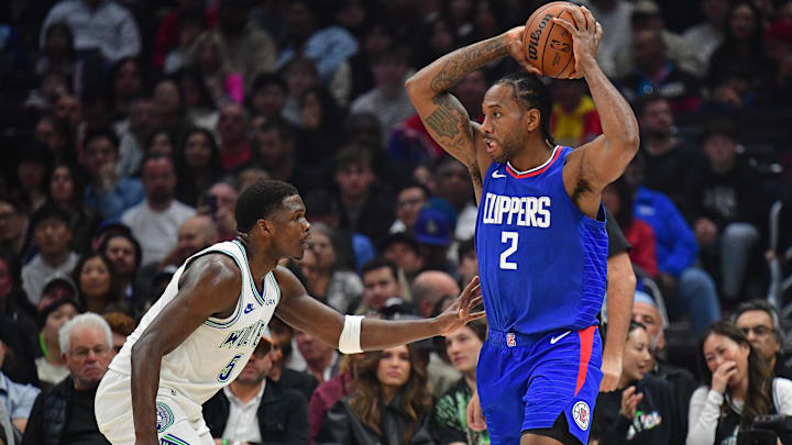 Mar 12, 2024; Los Angeles, California, USA; Los Angeles Clippers forward Kawhi Leonard (2) controls the ball against Minnesota Timberwolves guard Anthony Edwards (5) during the first half at Crypto.com Arena. Mar 12, 2024; Los Angeles, California, USA; Los Angeles Clippers forward Kawhi Leonard (2) controls the ball against Minnesota Timberwolves guard Anthony Edwards (5) during the first half at Crypto.com Arena.