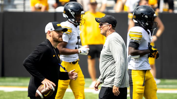 Aug 9, 2025; Iowa defensive coordinator Phil Parker walks down the field during the Hawkeyes Kids Day NCAA football open practice at Kinnick Stadium in Iowa City, Iowa. Mandatory Credit: Joseph Cress for the Des Moines Register
