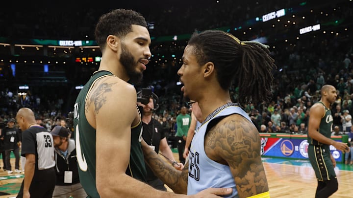 Feb 12, 2023; Boston, Massachusetts, USA; Boston Celtics forward Jayson Tatum (0) and Memphis Grizzlies guard Ja Morant (12) talks after the Celtics win at TD Garden. Mandatory Credit: Winslow Townson-Imagn Images
