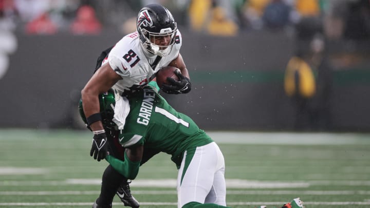 Dec 3, 2023; East Rutherford, New Jersey, USA; Atlanta Falcons tight end Jonnu Smith (81) is tackled by New York Jets cornerback Sauce Gardner (1) during the first half at MetLife Stadium. Dec 3, 2023; East Rutherford, New Jersey, USA; Atlanta Falcons tight end Jonnu Smith (81) is tackled by New York Jets cornerback Sauce Gardner (1) during the first half at MetLife Stadium.