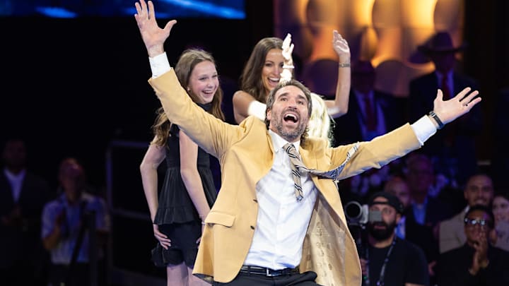 Aug 1, 2025; Canton, OH, USA; Jared Allen celebrates with his family after receiving his gold jacket at the 2025 Pro Football Hall of Fame Enshrinees’ Gold Jacket Dinner at Canton Memorial Civic Center.