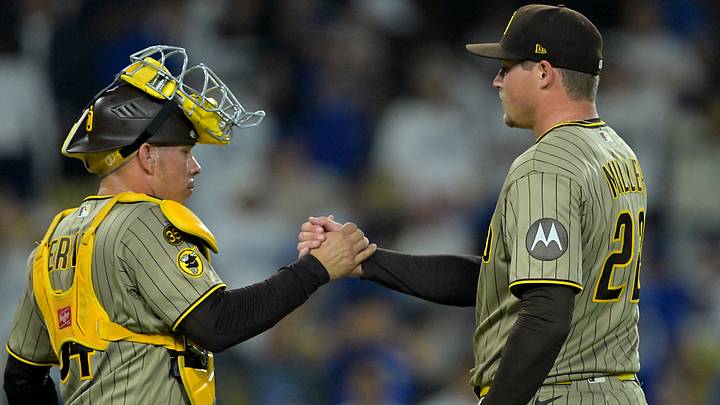 San Diego Padres catcher Freddy Fermin (54) shakes hands with relief pitcher Mason Miller (22) after the final out of the ninth inning against the San Diego Padres at Dodger Stadium on Sept. 23, 2026. San Diego Padres catcher Freddy Fermin (54) shakes hands with relief pitcher Mason Miller (22) after the final out of the ninth inning against the San Diego Padres at Dodger Stadium on Sept. 23, 2026.