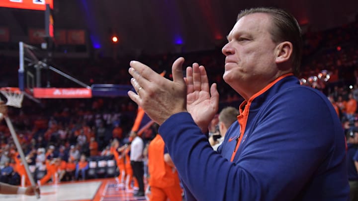 Nov 13, 2024; Champaign, Illinois, USA;  Illinois Fighting Illini head coach Brad Underwood applauds the crowd before a against the Oakland Golden Grizzlies at State Farm Center. Mandatory Credit: Ron Johnson-Imagn Images